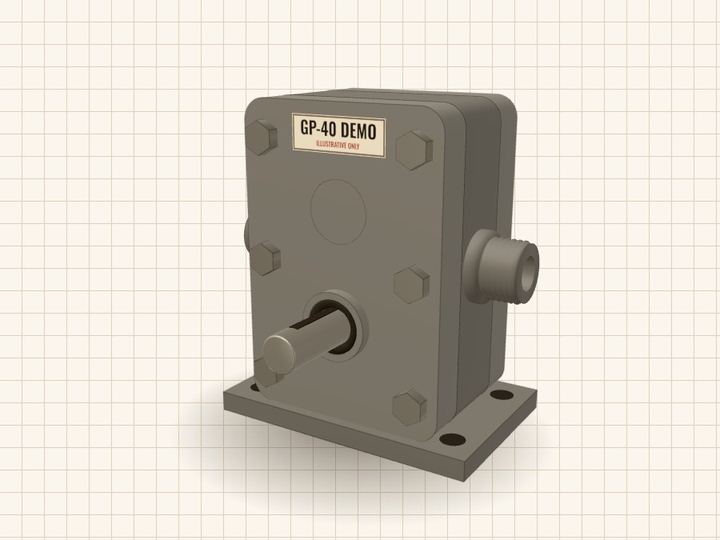 GP-40 Demo pump assembled, seen from the front right: a grey cast block with two threaded ports, pale steel gears behind a front cover, and a keyed drive shaft pointing at the viewer.